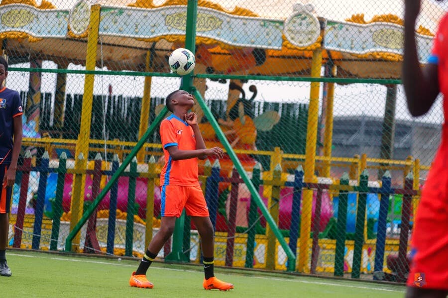 Bright Academy player training near the goal