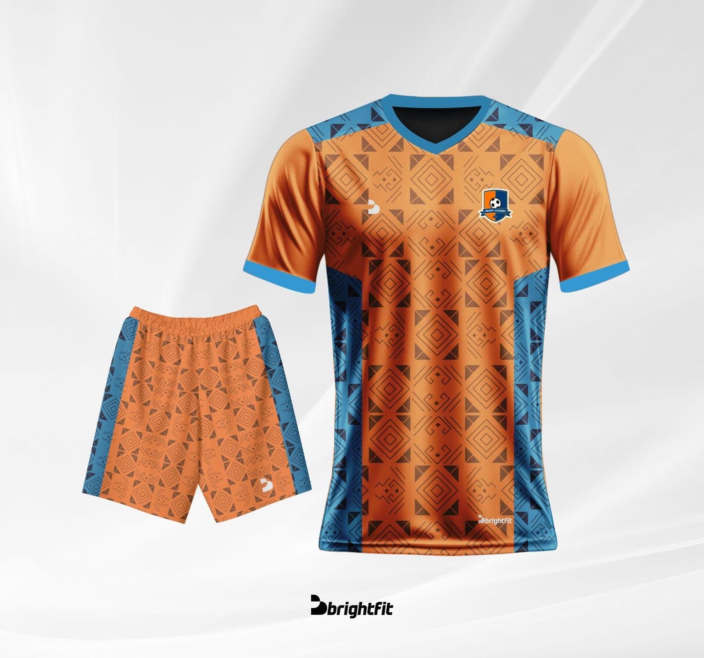 Bright Academy home kit — orange jersey and shorts with navy/blue side panels, official BrightFit product render